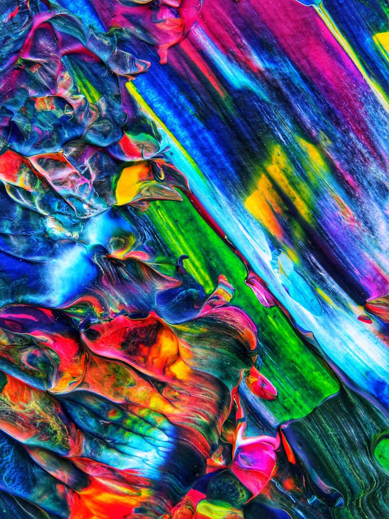 Dynamic and colorful abstract acrylic painting with bold textures and vibrant hues.